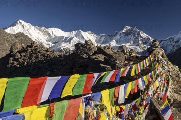 Buddhist prayer flags marking the summit of Gokyo Ri, the popular trekking peak in the Everest