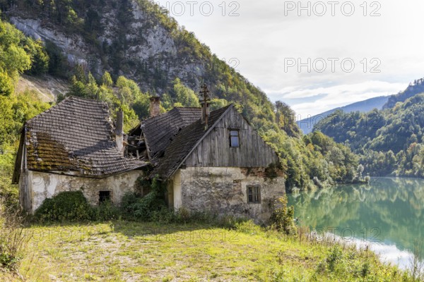 Deserted farm at the Enns river in Upper Austria. The roof is collapsed. The management of the farm