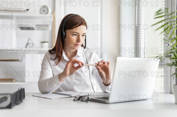 Portrait woman work having video call laptop