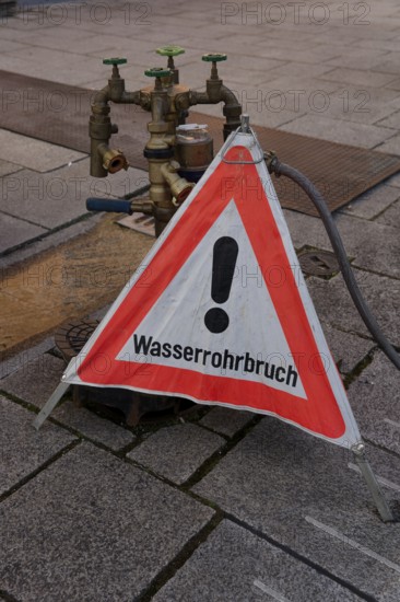 Burst water pipe, damage, pipe, warning sign, notice, sign, attention, danger, water damage,