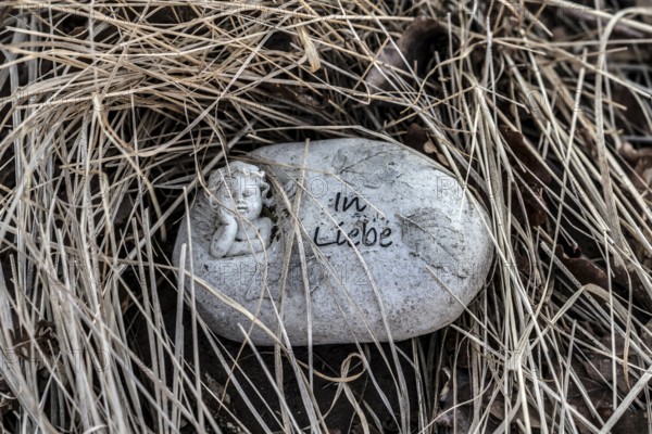 A heart with the inscription in love, natural burial grave site, Friedwald, Reinhardswald Forest,