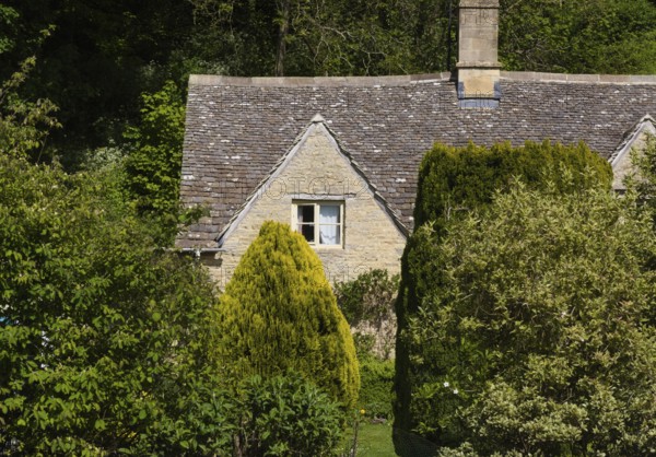Small houses in typical Cotswolds style adorn the streets of the small town of Bibury