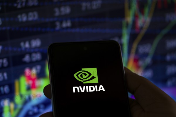 Dhaka, Bangladesh 11 Nov 2024: Nvidia logo on smartphone screen with AI in the background. Nvidia