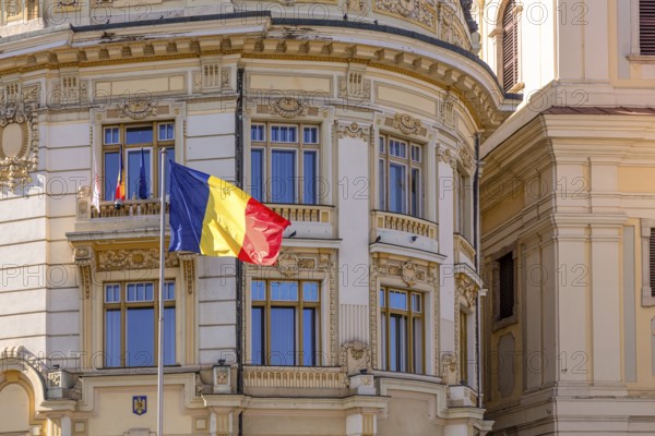 Romanian flag in front of the building that house Sibiu municipality, Sibiu, Transylvania, Romania,