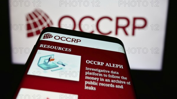 Stuttgart, Germany, 05-22-2024: Mobile phone with webpage of Organized Crime and Corruption