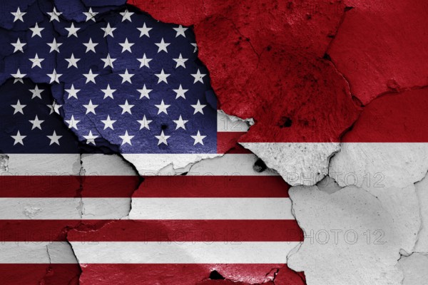 Flags of USA and Indonesia painted on cracked wall