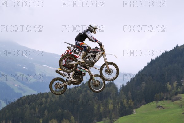 Tandem jump at the Tyrolean Motocross Championships, Aschau in Zillertal Valley, Tyrol, Austria,