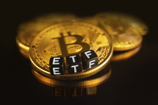 Bitcoin Exchange-traded fund ETF launch concept with coins and letters