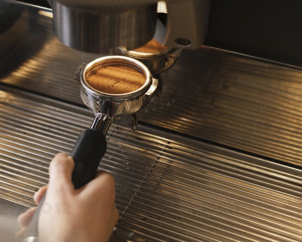 Close up hand preparing coffee with machine. Resolution and high quality beautiful photo