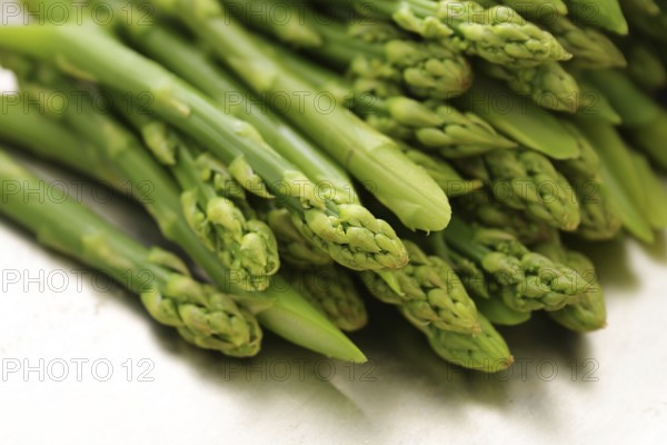 Green asparagus shots, blanched or cooked, healthy spring vegetable, selected focus, narrow depth