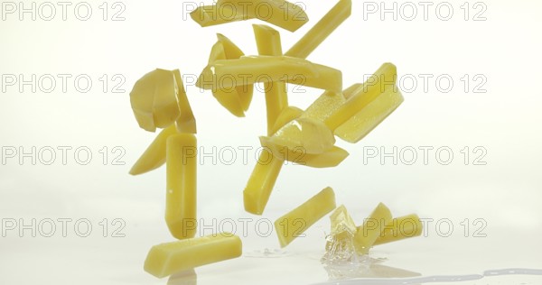 French Fries, Charlotte Potato (solanum tuberosum), Vegetable falling on Water against White