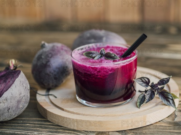 Wooden tray with glass beetroot juice. High resolution photo