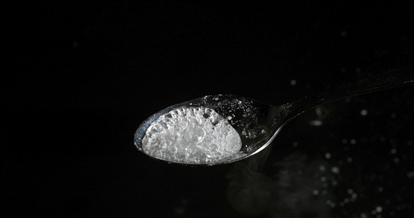 Drug, Cocaine in spoon against black background