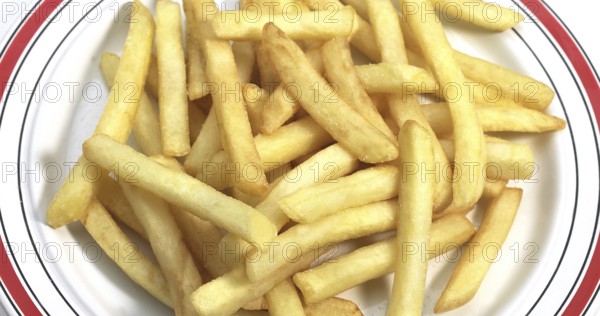Plate with French Fries against White Background