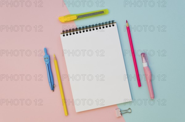 Top view notebook with colorful pens