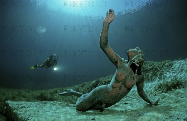 Diver in a mountain lake and King Ludwig mermaid, Germany, Bavaria, Europe