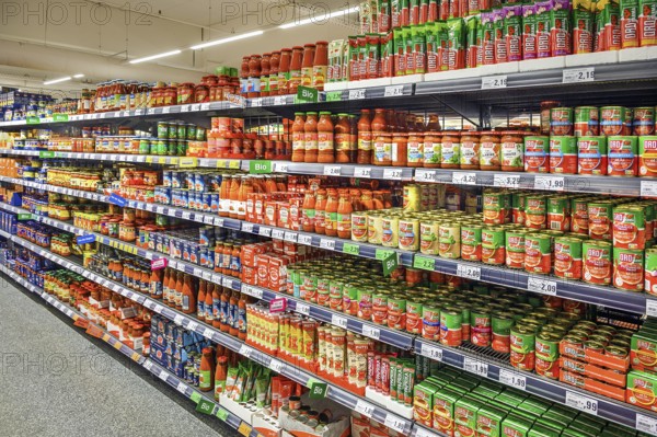 Shelf with tomato sauce and tomato paste in a wholesale store, Kempten, Allgäu, Bavaria, Germany,
