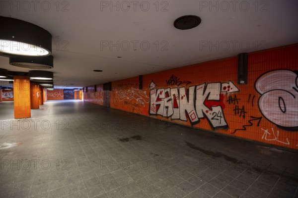Completely neglected, dirty subway, tunnel, pedestrian tunnel, Messedamm, between International