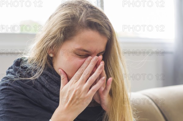 Great concept of allergy, rhinitis, cough. Young blonde woman coughing