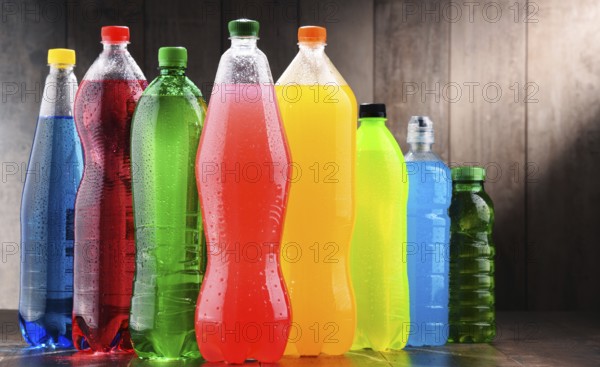 Plastic bottles of assorted carbonated soft drinks in variety of colors