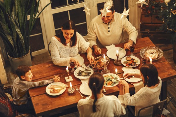 View from above of happy large family with many children celebrating Christmas or New Year eve