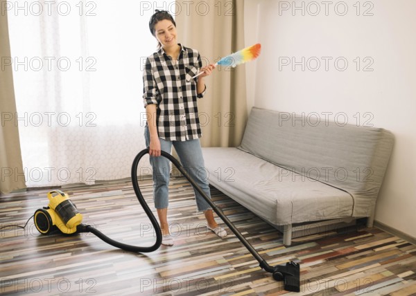 Woman vacuuming living room