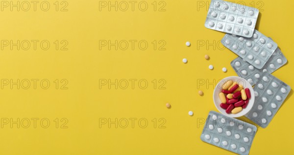Flat lay pills with foils copy space