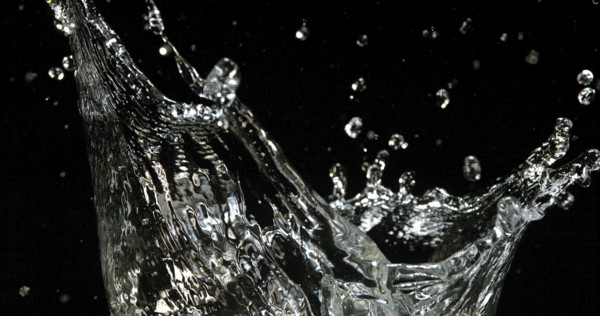 Water Exploding and Splashing against Black Background