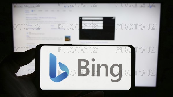 Stuttgart, Germany, 09-22-2023: Person holding cellphone with logo of web search engine Microsoft