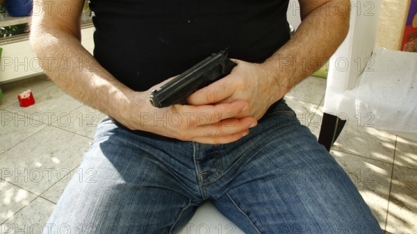 Hands holding a pistol