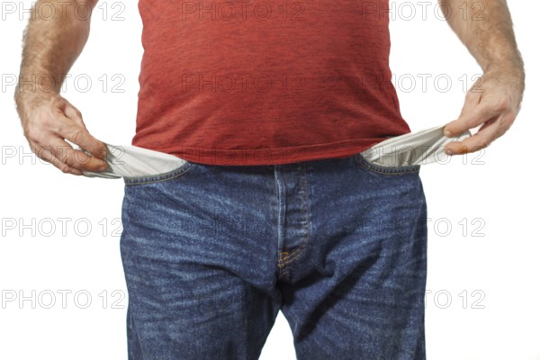 Man in blue jeans and red t-shirt showing his empty pockets white background and copy space