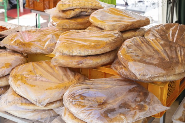Packaged flatbreads for sale at a market stall