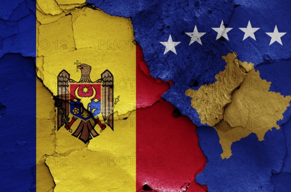 Flags of Moldova and Kosovo painted on cracked wall