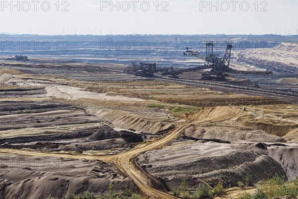 View over the Garzweiler open-cast lignite mine with large excavator, Rhenish lignite mining area,