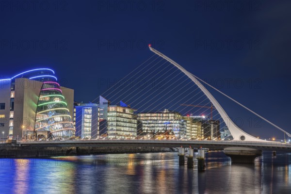 The harbour area with the Samuel Beckett Bridge in Dublin, Ireland, at night, Europe