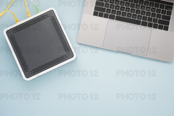 Flat lay desk with laptop wireless router