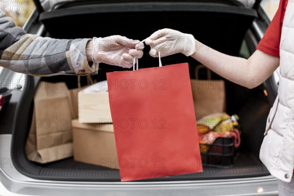 Close up hands holding paper bag