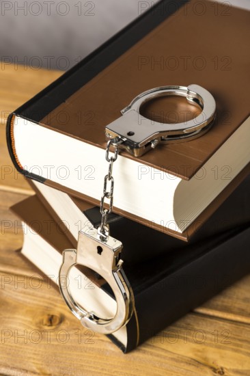 Close up with handcuffs books