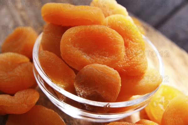 Composition with a bowl of dried apricots. Delicacies