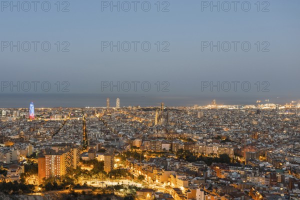 Top view and night photography from an illuminated Barcelona. The panorama shows the famous Sagrada