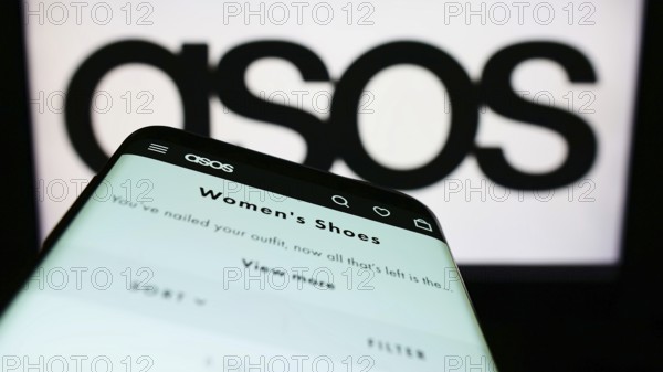 Stuttgart, Germany, 06-18-2022: Mobile phone with webpage of British fashion retail company ASOS