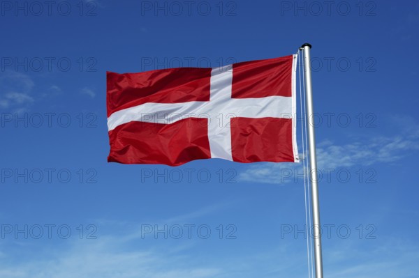 The flag of Denmark flutters in the wind
