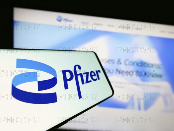 Stuttgart, Germany, 08-06-2023: Cellphone with logo of American pharmaceutical company Pfizer Inc.