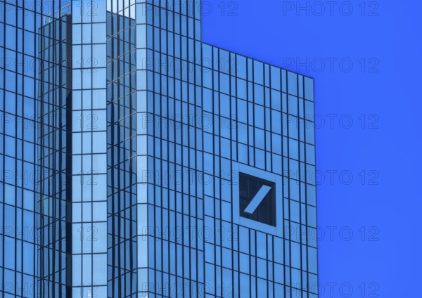 Twin towers of the Deutsche Bank headquarters with the company logo slash in the square, Frankfurt