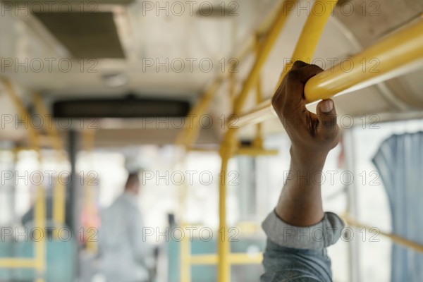 Close up hand holding bus bar