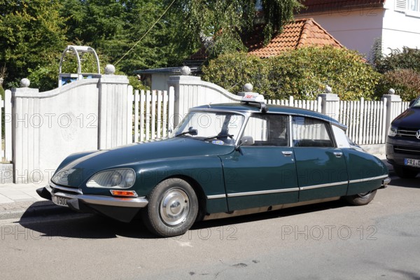 Vintage Citroen DS parked on the street in front of a garden fence, Varel, Lower Saxony, Germany,