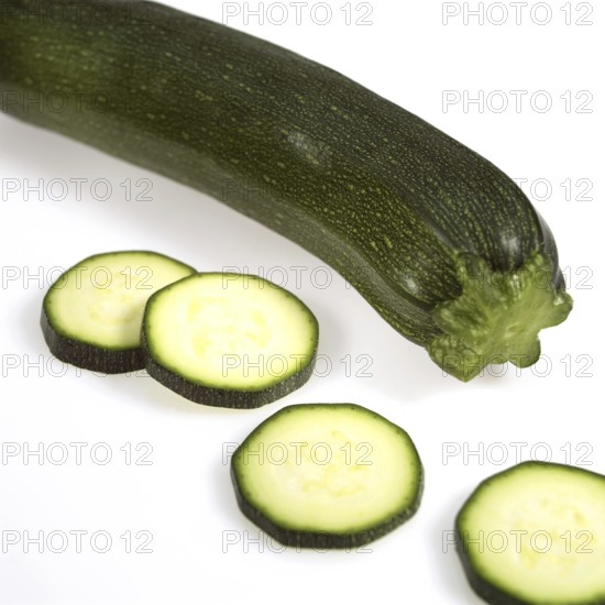 Long Courgette or Zucchini (cucurbita pepo) against White Background