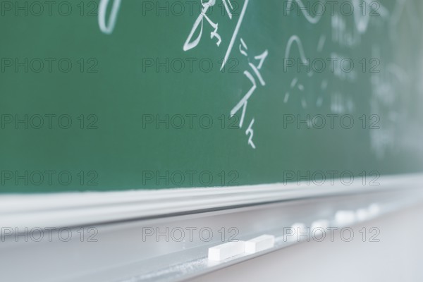 Chalkboard with written mathematical formulas