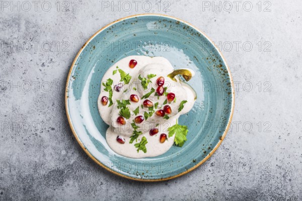 Top view of chiles en nogada, traditional festive dish on Mexican Independence Day. Green peppers