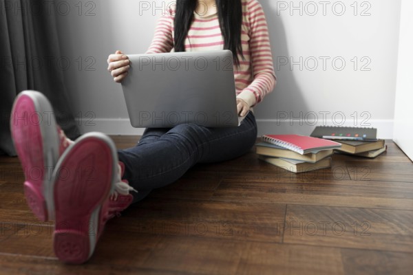 Close up student holding laptop